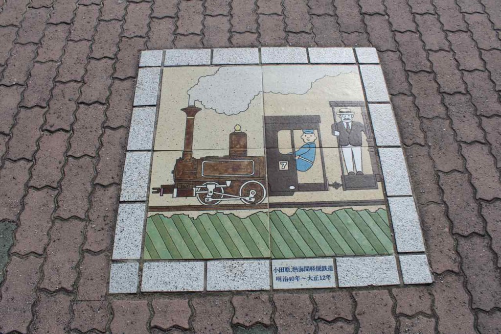 Train tiled art on path